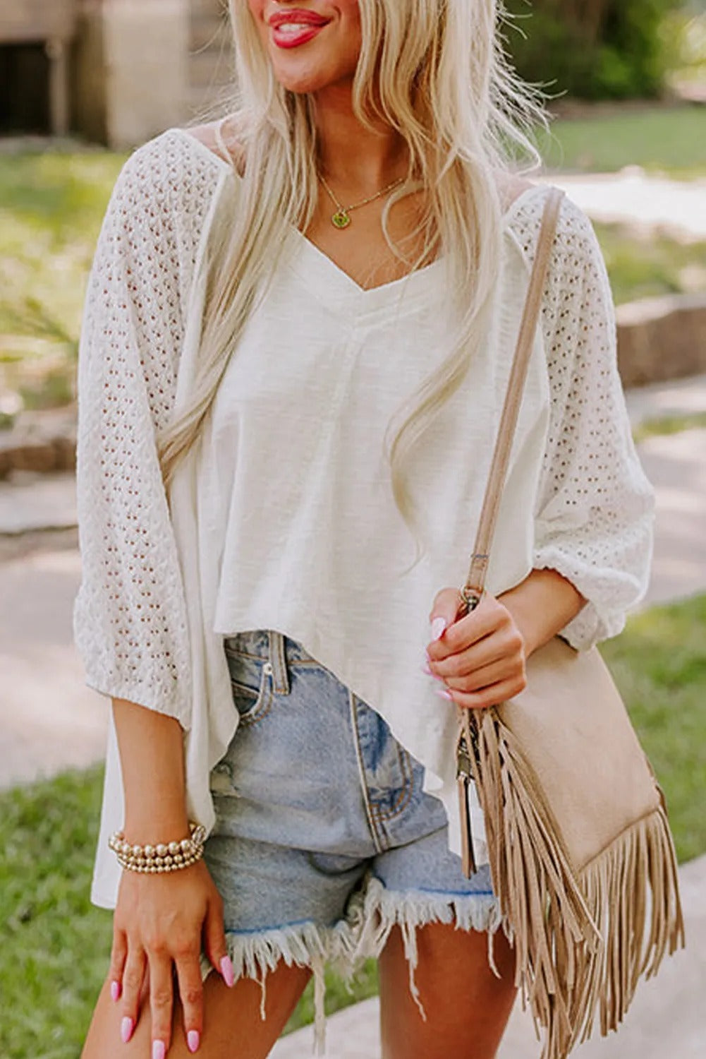 White wide-neck blouse with patchwork sleeves