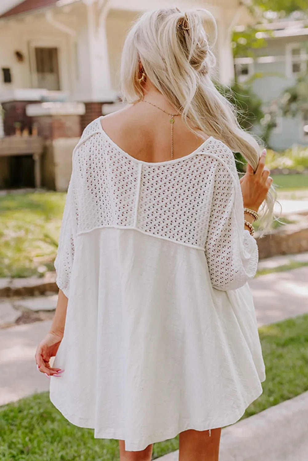 White wide-neck blouse with patchwork sleeves
